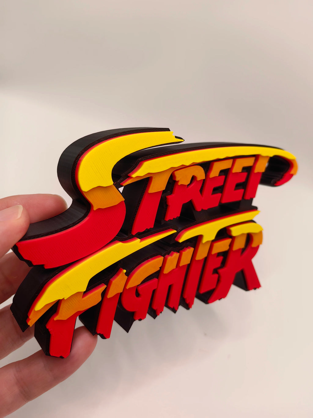Street Fighter, Street Fighter (abbreviation), arcade game, Street Fighter Logo, signboard, action figure, ornament.