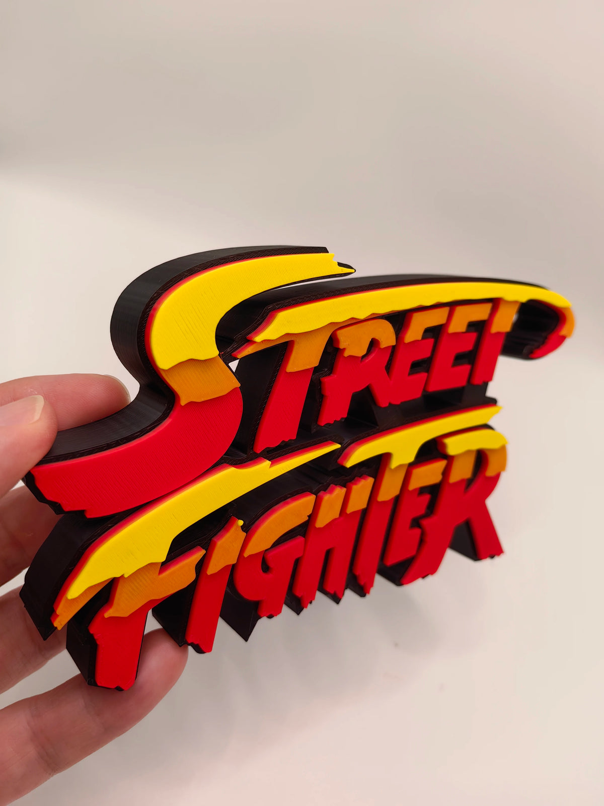 Street Fighter, Street Fighter (abbreviation), arcade game, Street Fighter Logo, signboard, action figure, ornament.